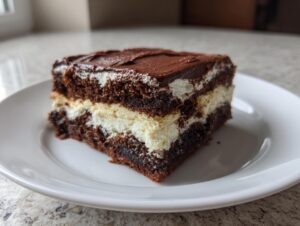 Close-up of a rich slice of Italian love cake showing dark chocolate cake layers and creamy filling.